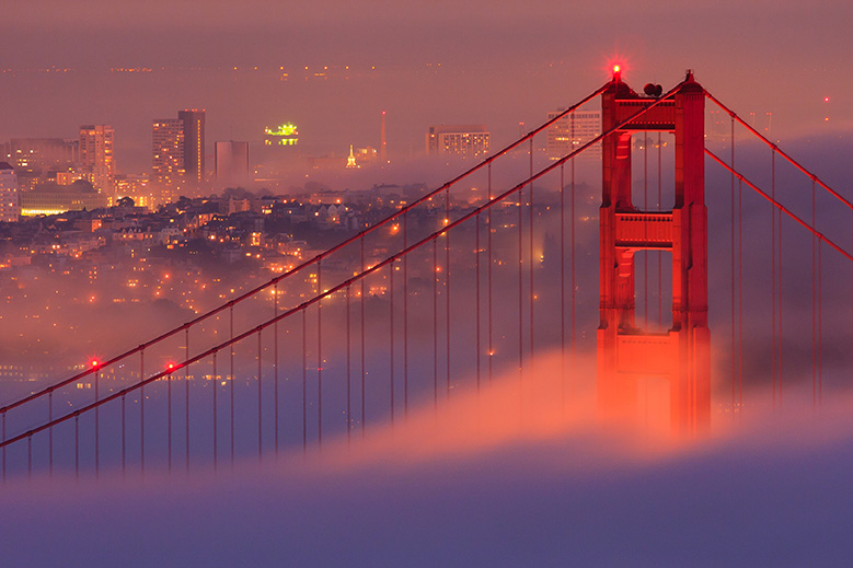 San Francisco Golden Gate Bridge in fog by Radoslaw Lecyk